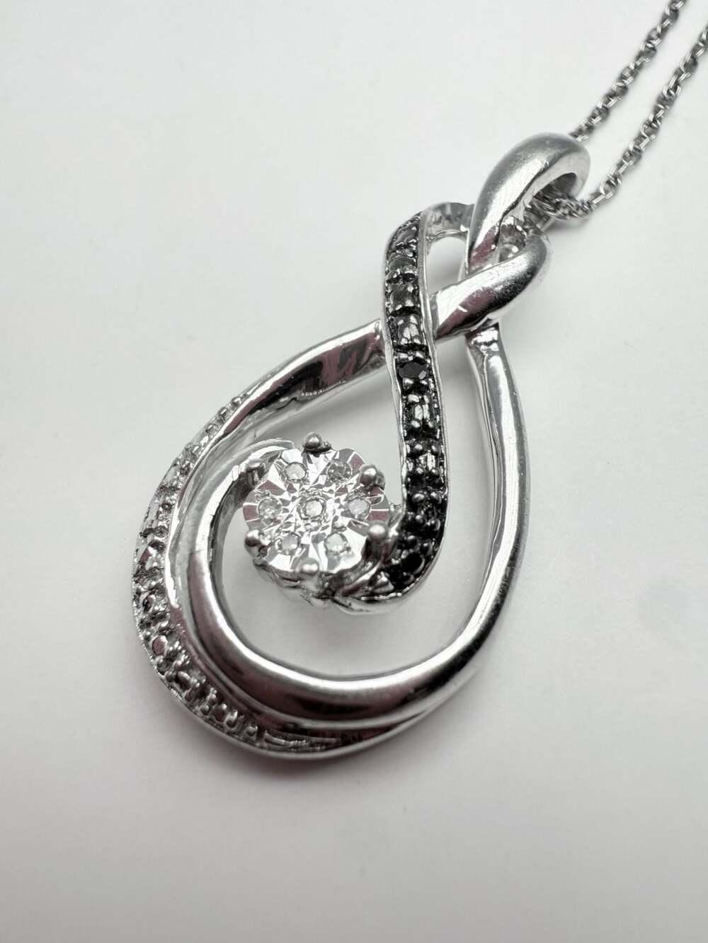 Sterling Silver White And Black Diamond Swirl Pendant Necklace